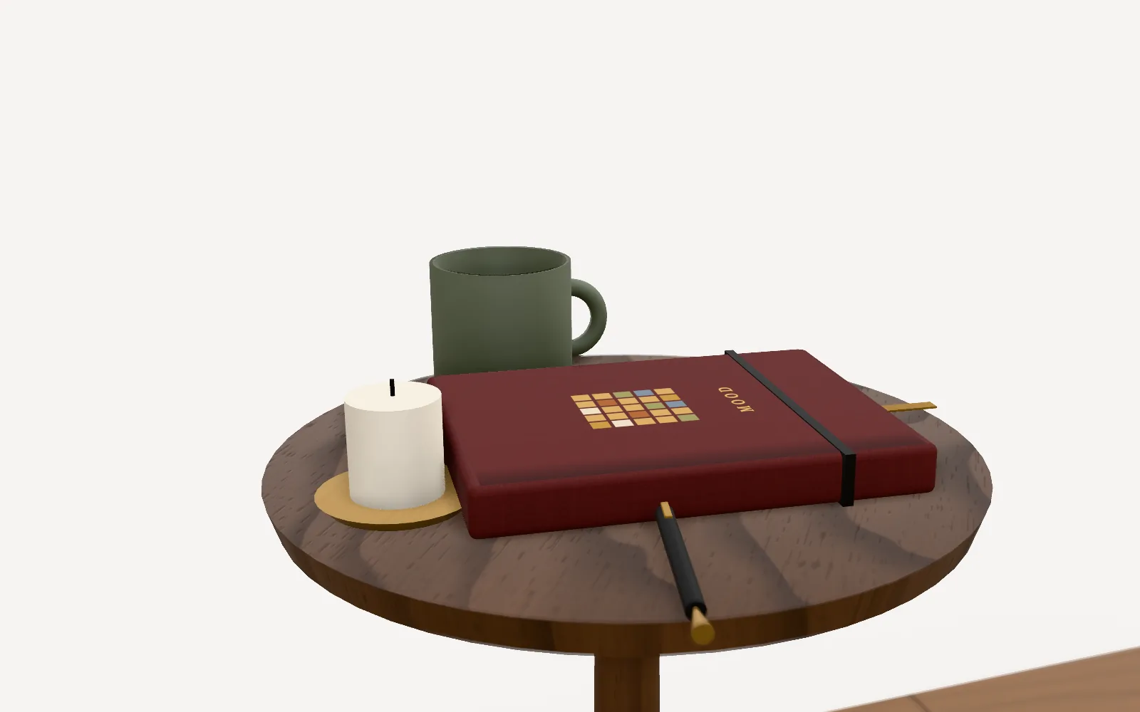 A cloth journal with a mosaic of mood tiles on its cover, next to a candle and a cup of tea.