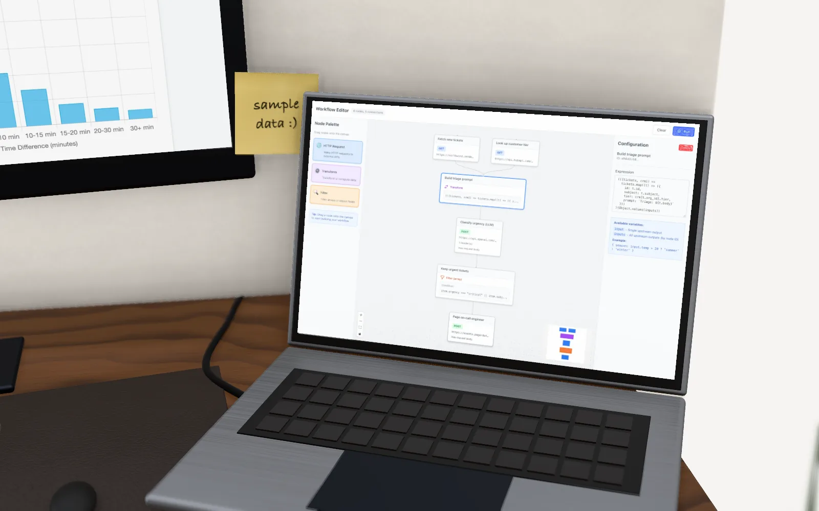 The laptop on the desk, open on the workflow editor canvas.